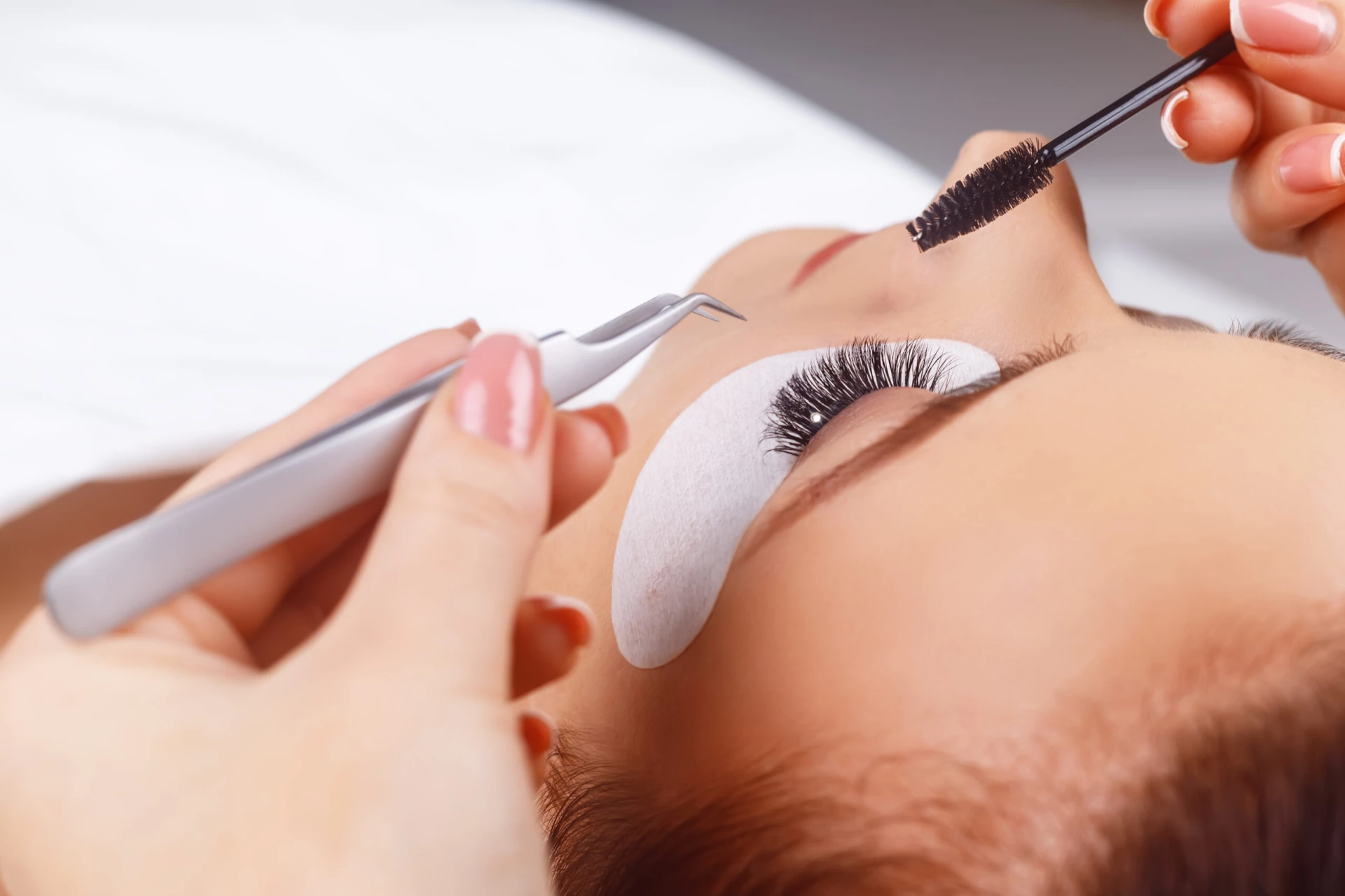 Eyelash Extension Procedure. Woman Eye with Long Eyelashes. Eyelashes with rhinestone. Lashes, close up, macro, selective focus. For Your Eyes